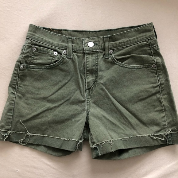 green levi shorts